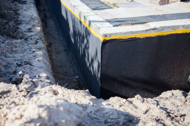 Professional Basement Waterproofing technician working in Munroe Falls, OH